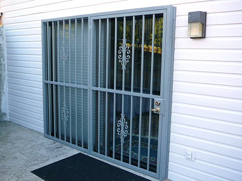 Custom Cathedral Slider design security door with anti-pry bars and reinforced steel installed in Portland, Oregon