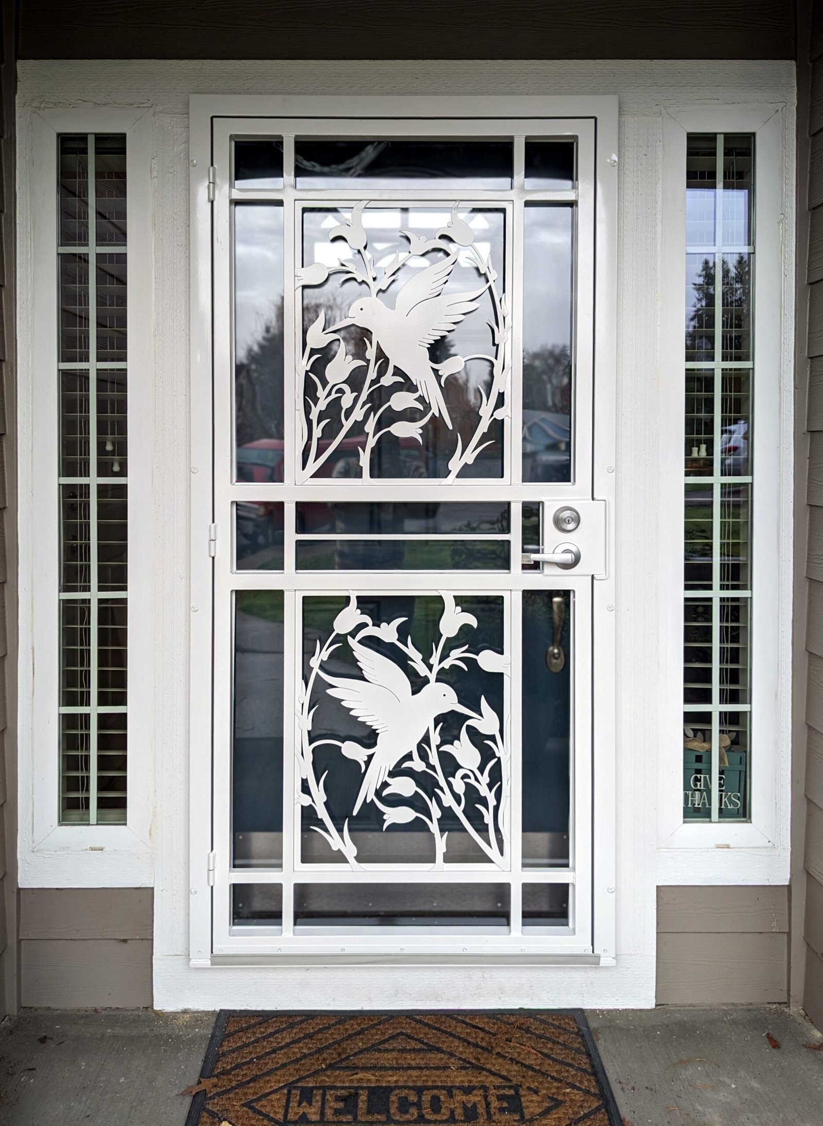 Steel security door with double hummingbird waterjet inserts Portland